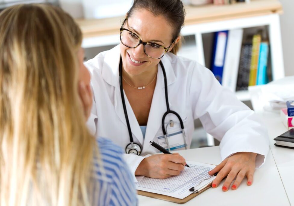 Portrait of female doctor explaining diagnosis to her patient.