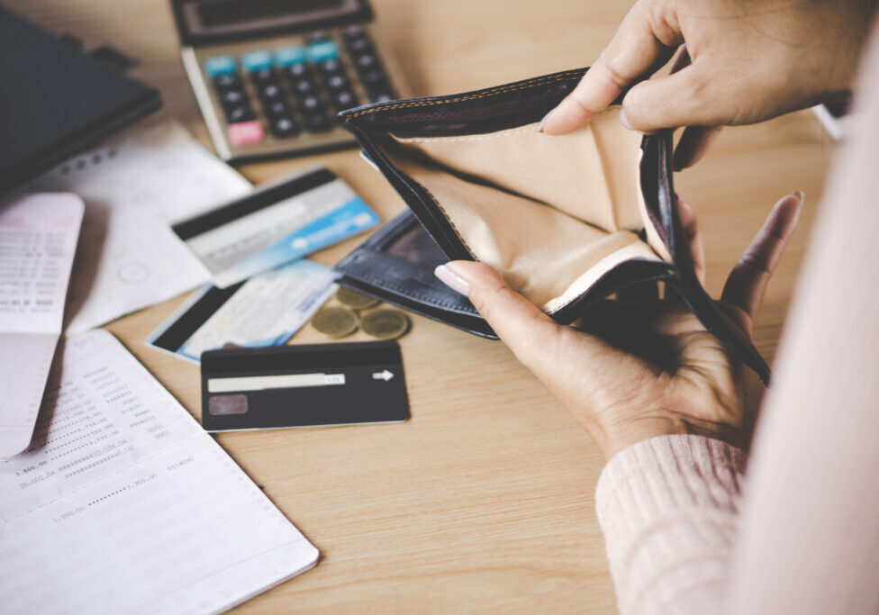 poor Asian woman hand open empty purse looking for money having problem  bankrupt broke after credit card payment