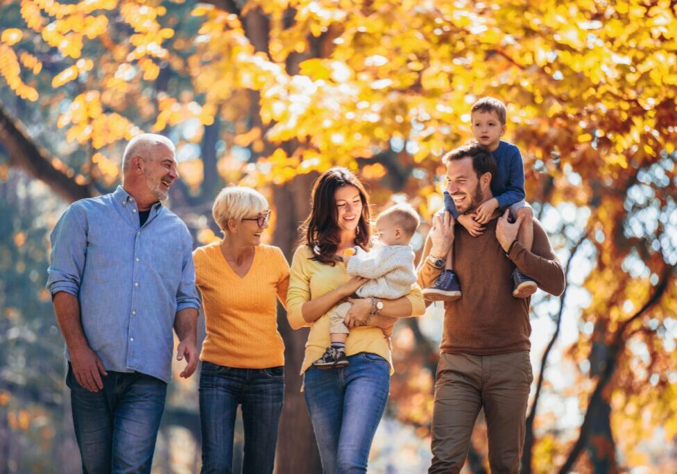 Multl generation family in autumn park having fun