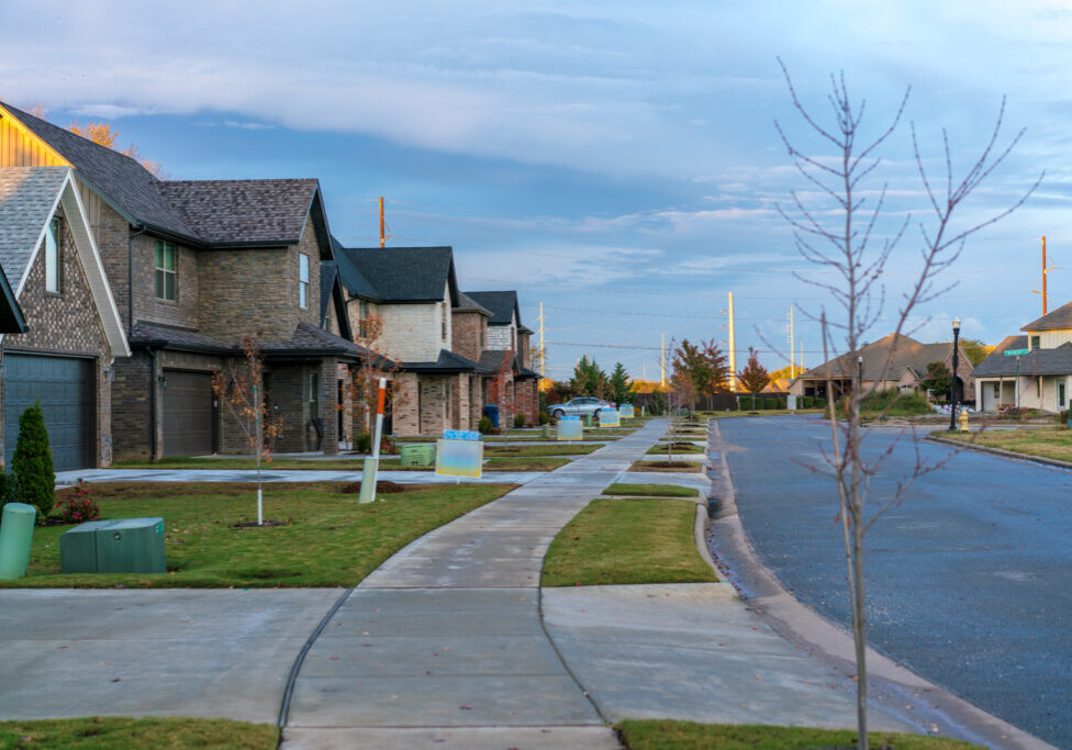 Living in Residential Housing Neighborhood Street at Sunset in Bentonville Arkansas