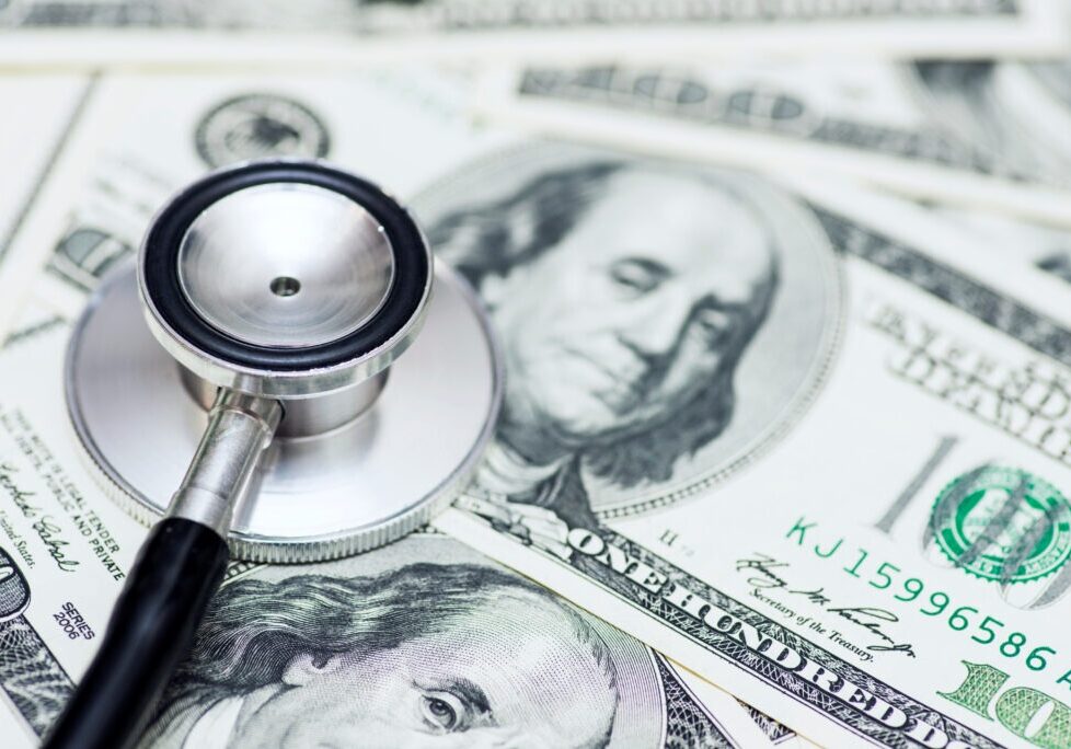 Stethoscope on the dollars. Medical costs. Healthcare payment concept. Concept of analysis of the market and economy and interest rates.