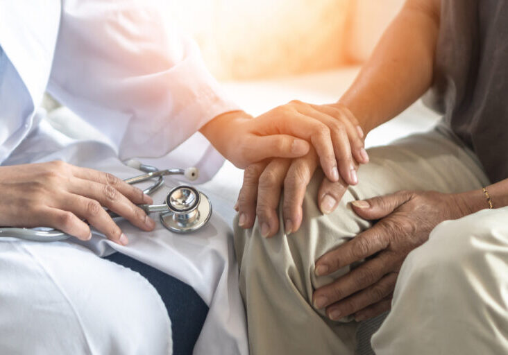 Parkinson's disease patient, Arthritis hand and knee pain or mental health care concept with geriatric doctor consulting examining elderly senior aged adult in medical exam clinic or hospital
