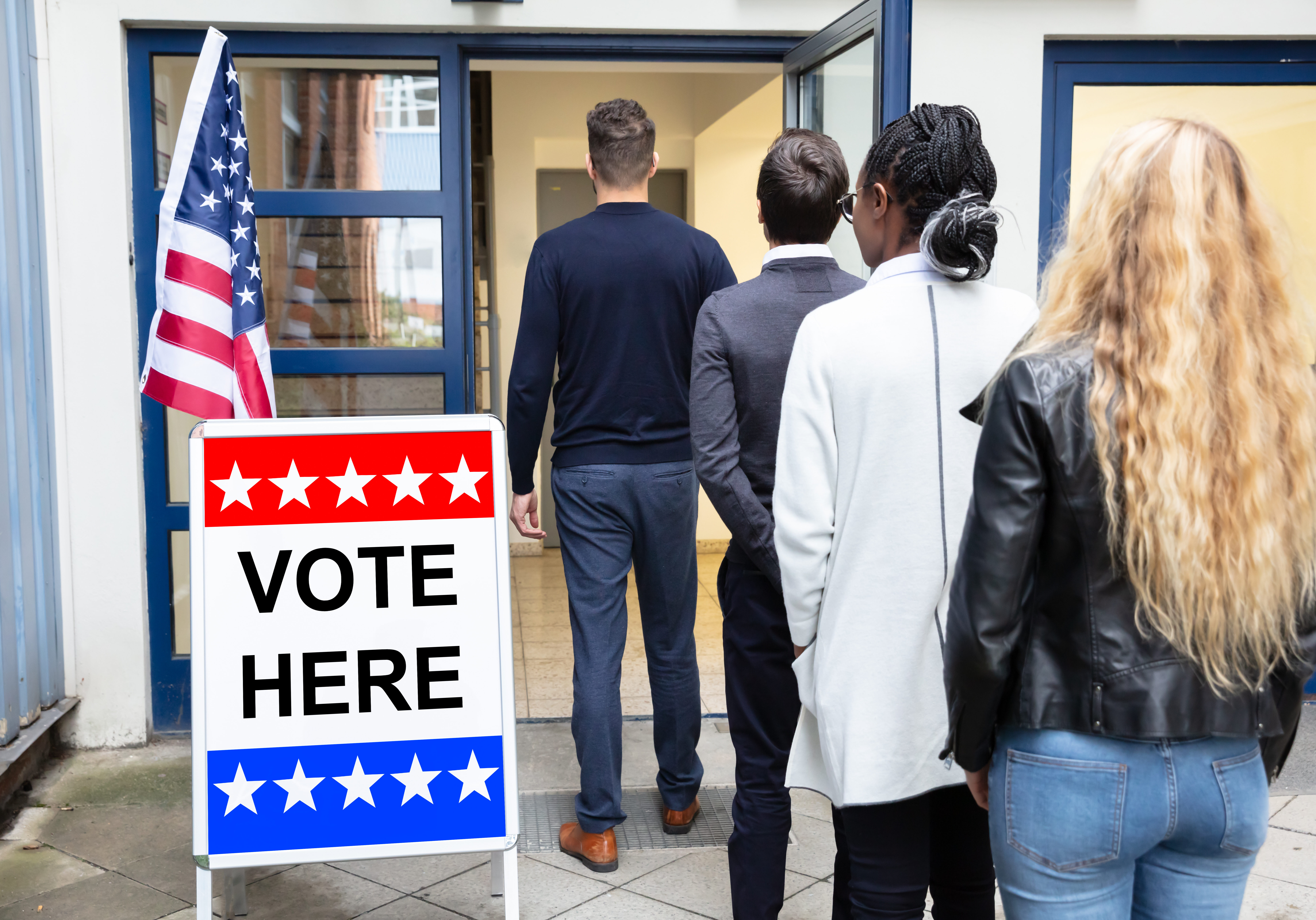 Group Of Young People Standing At The Entrance Of Voting Room