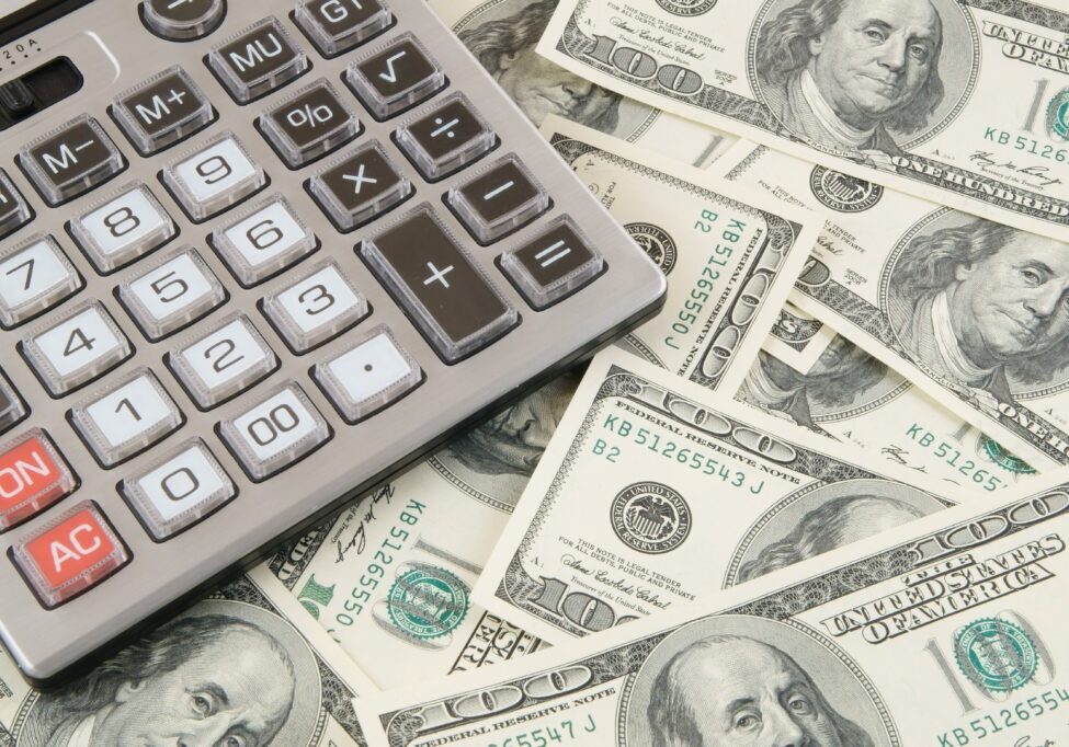 Business concept, calculator on money background