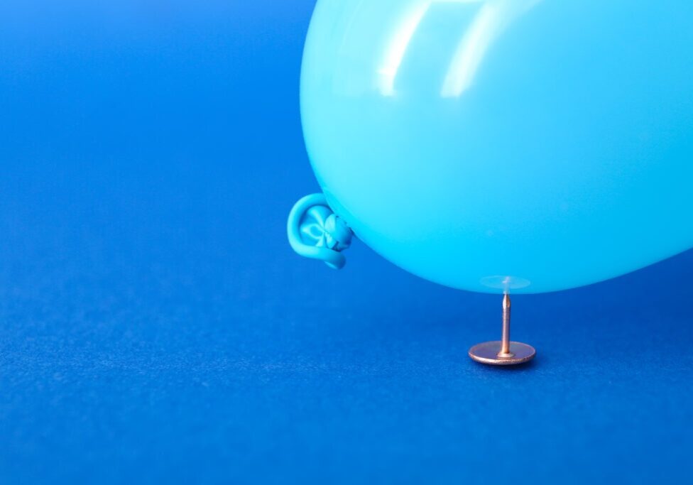 Office pin and air balloon on color background