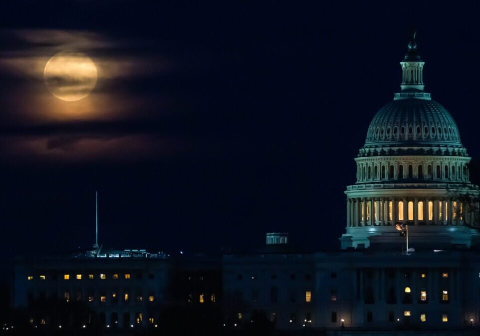 A supermoon seen as it rises behind the U.S. Capitol in Washington DC. Digitally enhanced. Image furnished by NASA.