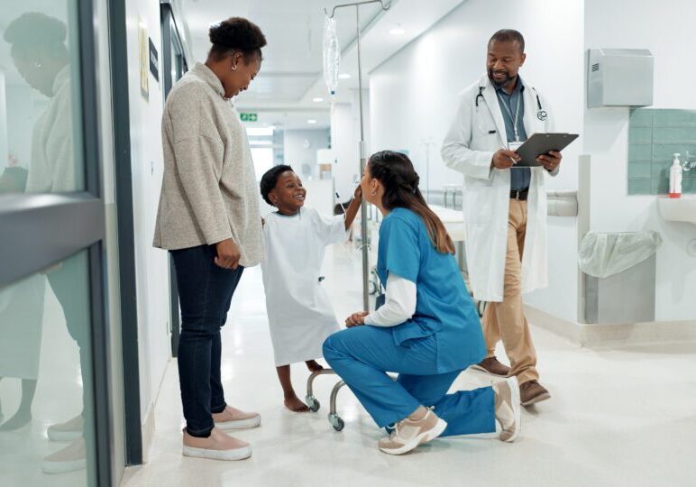Black family, medicine and a pediatrician talking to a patient in the hospital for medical child care. Kids, trust or healthcare and a nurse consulting a boy with his mother in the clinic for health.